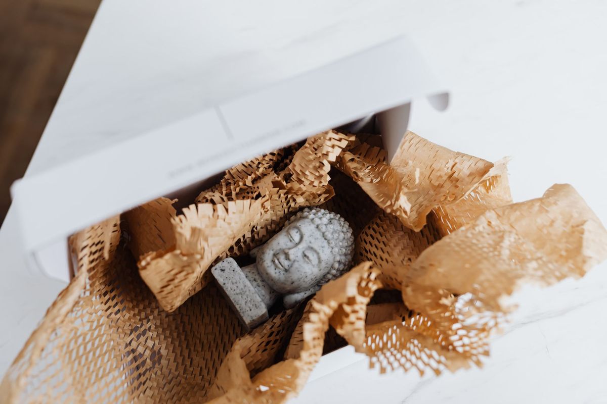Stone ornament unboxed from honeycomb kraft paper